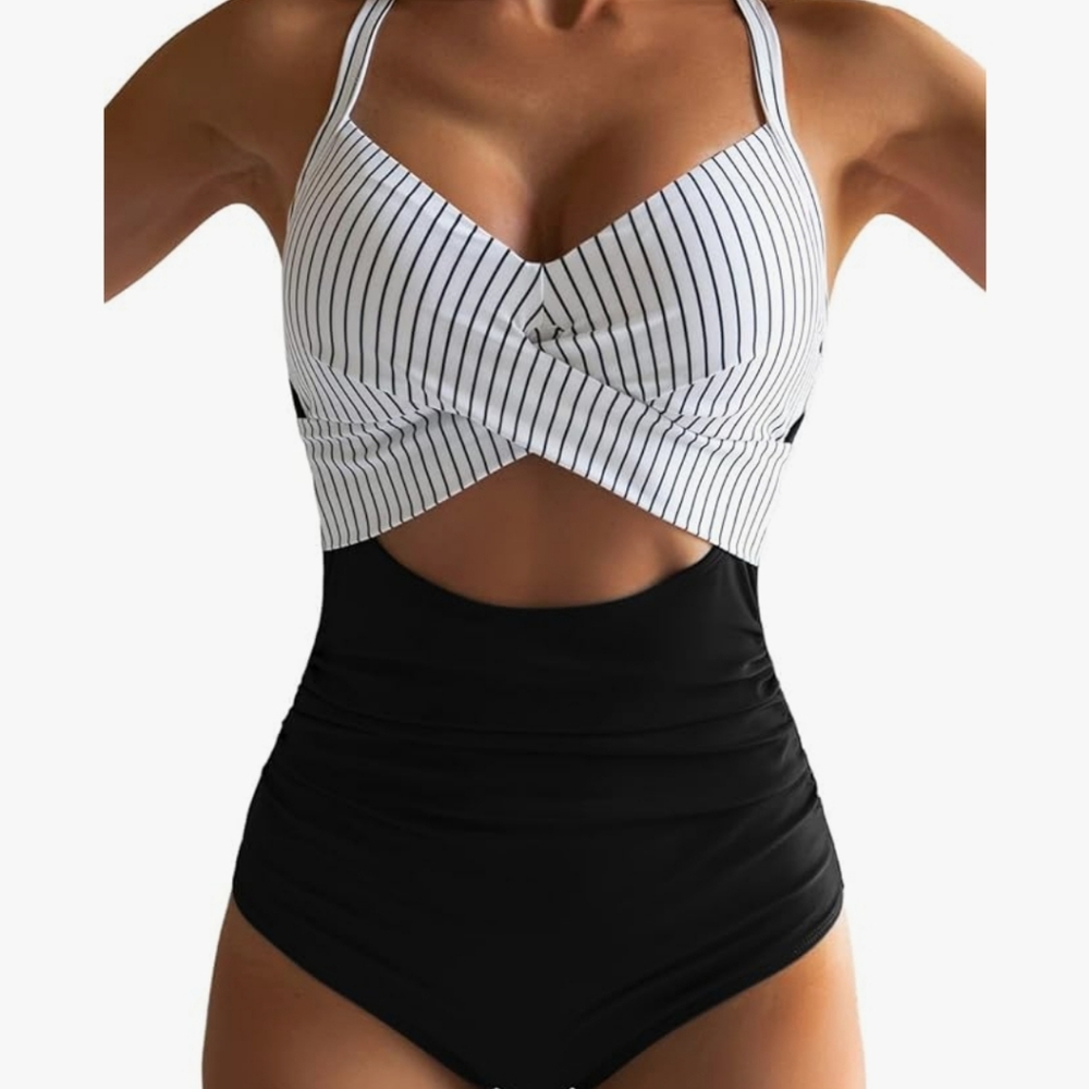 Women's one piece, cut out swimsuit. Worn once since taking photos!